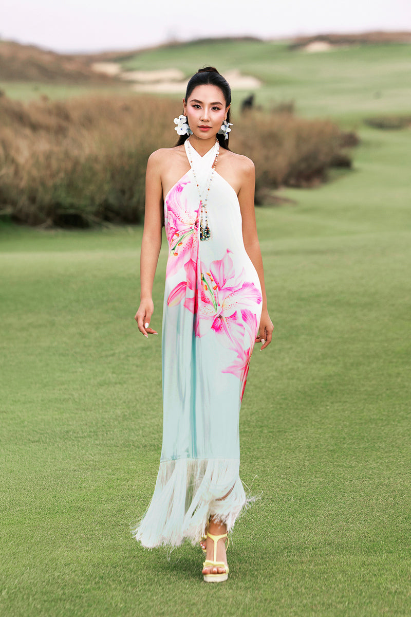 Valenciani Riviera halter maxi dress in vibrant multicolor with flowing fabric and halter neckline, perfect for summer occasions.
