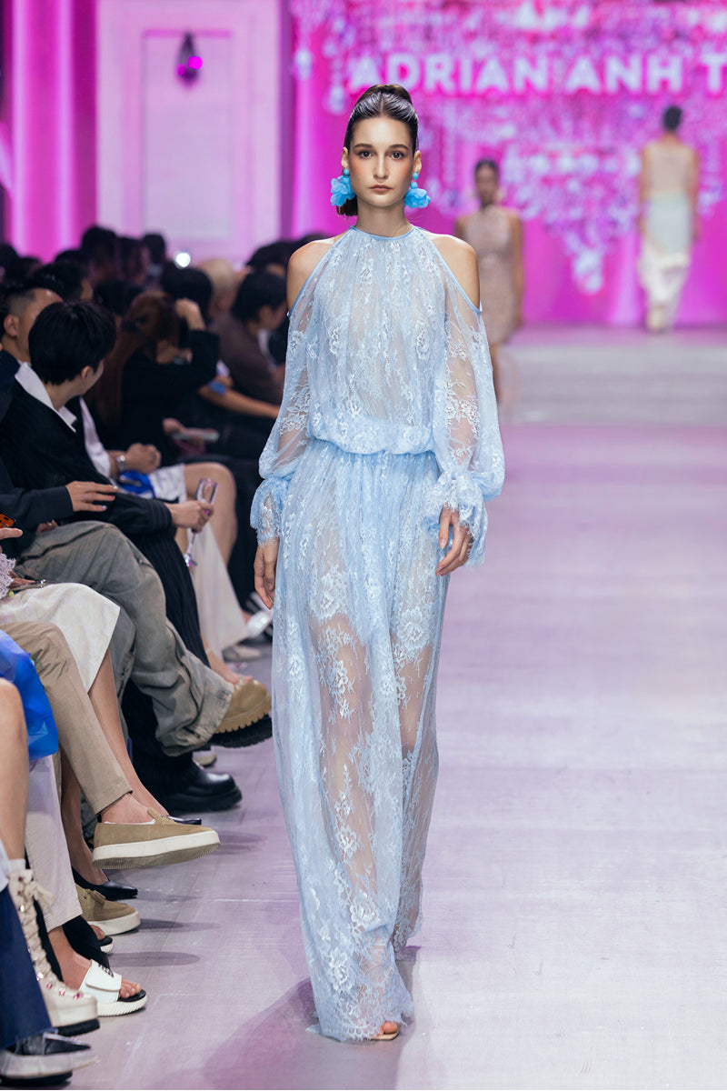 Ice blue Valenciani cold shoulder maxi lace dress with flowy silhouette and intricate lace details displayed in the image.