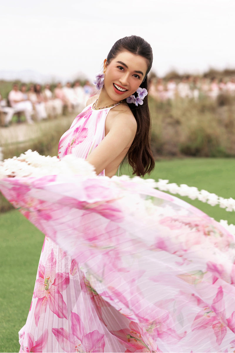 Valenciani halter neck pleated maxi dress in multicolor, flowing design with a fitted bodice and full-length skirt.