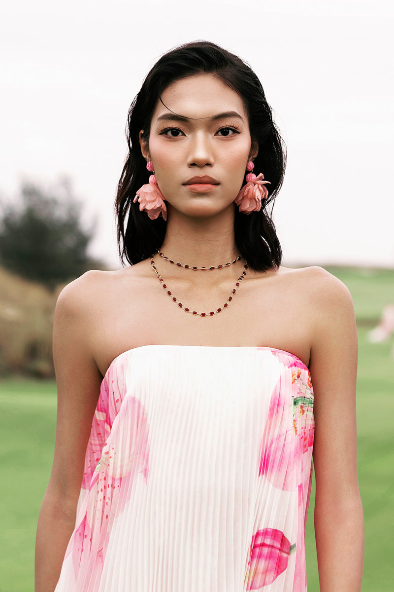 Valenciani CULT MIA X VALENCIANI The Blossom pleated maxi gown, flowing fabric with floral design and elegant silhouette.