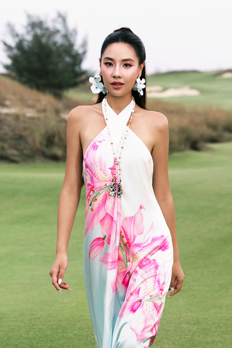 Valenciani Riviera halter maxi dress in vibrant multicolor with flowing fabric and stylish design, perfect for summer wear.