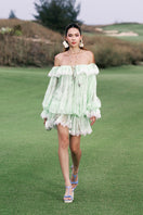 Valenciani off-shoulder lace mini dress displayed on a hanger, featuring delicate lace fabric and a stylish off-shoulder neckline.
