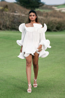 White Valenciani Origami Cloud Mini Dress shown on a model, featuring a stylish, modern design with a fitted silhouette and elegant details.