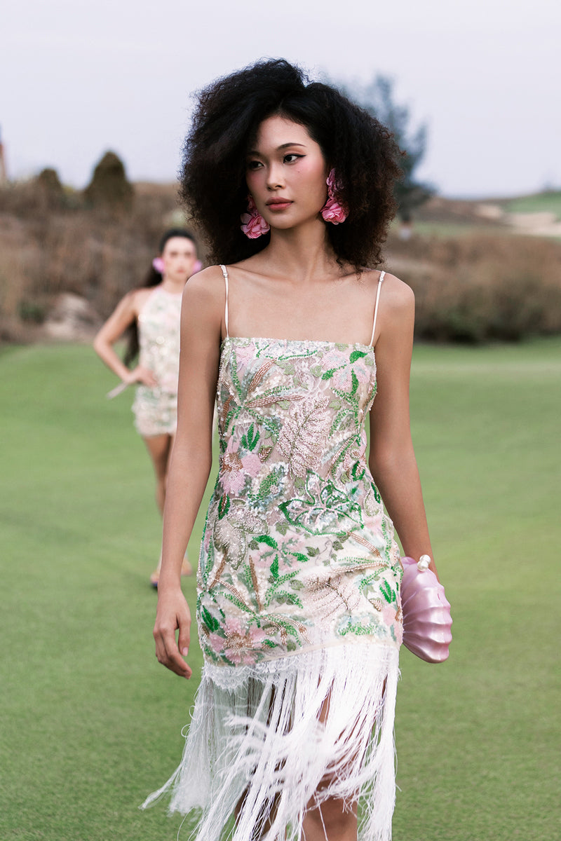 Multicolor sequin mini dress with fringe by Valenciani, featuring a fitted midi silhouette and shimmering embellishments.