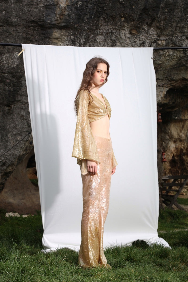 Aquarel Studio PYLA Pants in neutral fabric, featuring a relaxed fit and stylish design, displayed on a plain background.