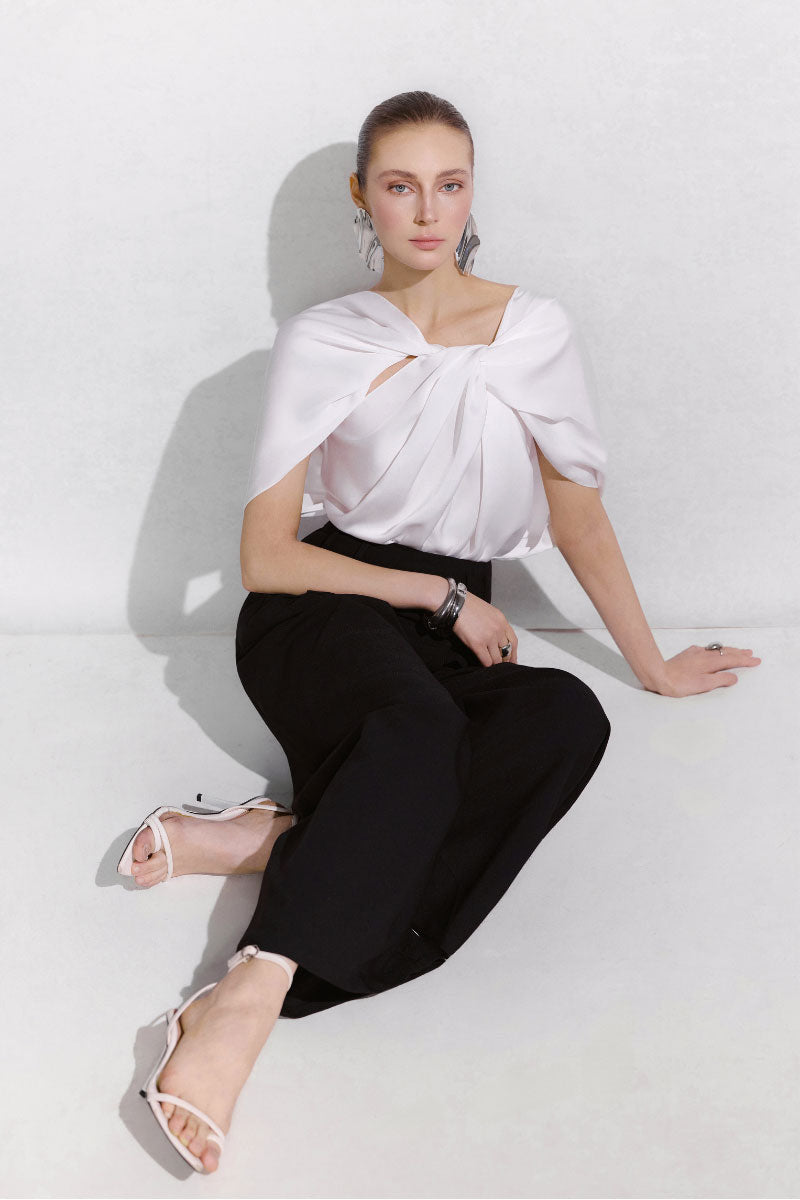 Black Arti Apparel LYN Pants laid flat showing slim-fit design and waistband detail.