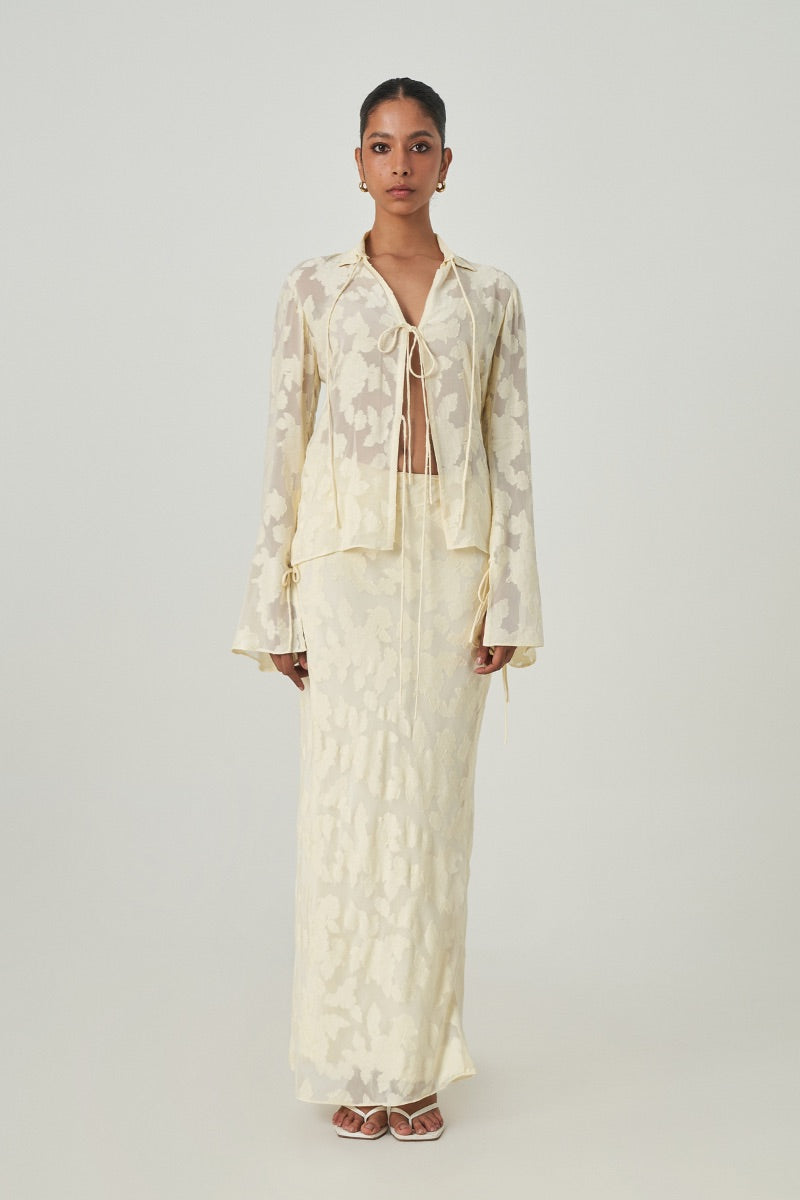 Light yellow maxi skirt from Summer Away's Evora collection, featuring a flowing design and elegant style.