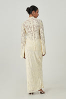 Light yellow Evora maxi skirt by Summer Away, flowing fabric with a relaxed fit, perfect for summer wear.