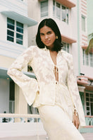 Light yellow Evora maxi skirt by Summer Away, flowing fabric, high waist, and elegant design, perfect for summer wear.