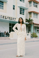 Light yellow EVORA maxi skirt by Summer Away, flowing fabric with a relaxed fit, perfect for warm-weather style.