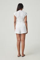 White summer shorts by Summer Away, casual DEIA shorts with a relaxed fit, displayed in a natural outdoor setting.