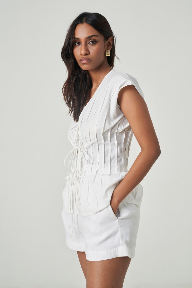 White DEIA Shorts by Summer Away, casual women's shorts with a comfortable fit, shown on a model.