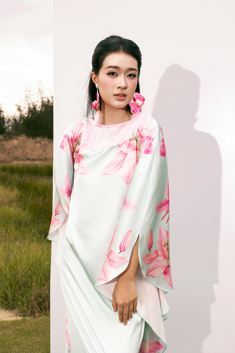 Colorful Valenciani Oasis Maxi Kaftan featuring vibrant multicolor patterns and flowing fabric, perfect for elegant summer wear.