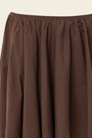 Brown modular mini skirt by IKINITA, showing close-up of the layered fabric and stylish design.