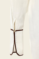 White boyfriend shirt by IKINITA featuring a classic collar and button-down design, displayed on a hanger.