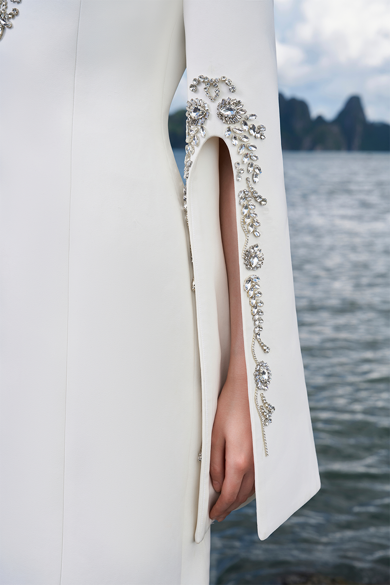 Tracy Studio long sleeve slit round neck gown featuring a sleek silhouette and elegant design, suitable for formal occasions.