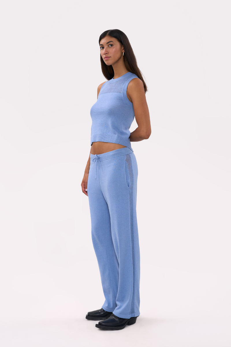 Light blue La Granni LA G top, showcasing its stylish design and fabric texture, perfect for casual or dressy looks.