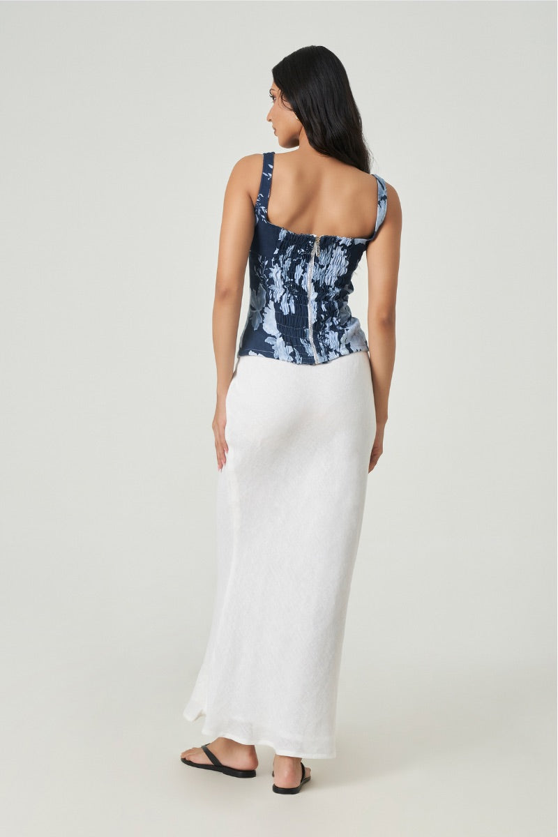 Midnight blue Lille top by Summer Away displayed on a hanger, featuring a stylish, casual sleeveless design for summer wear.
