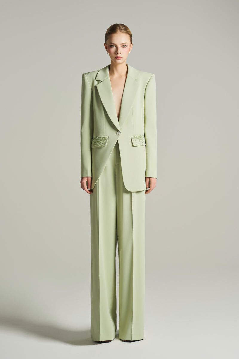 Mint single-breasted blazer by I.H.F Studio with asymmetric design and crystal-embellished pockets, stylish and elegant.
