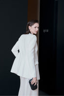 White Venice jacket by LEKIEU, stylish outerwear with a sleek design, shown on a model in this fashion-forward image.