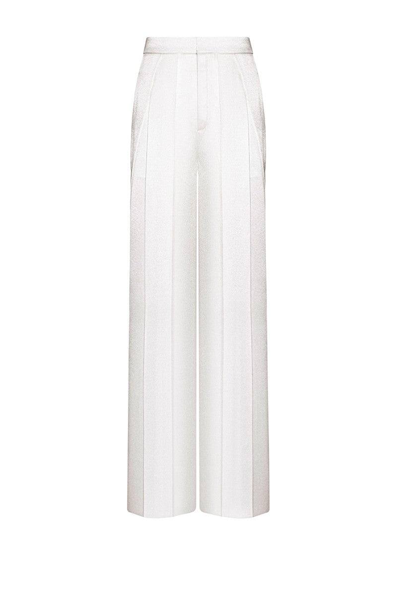 White LEKIEU CAEN pants displayed on a model, showcasing their stylish fit and fabric details.