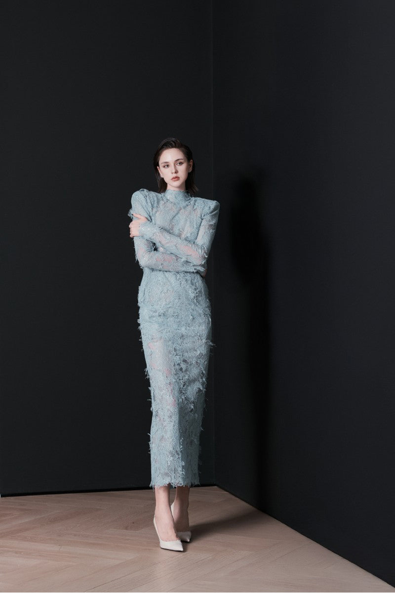 Blue LEKIEU Verona midi dress displayed on a model, showcasing its elegant design and flowing fabric.