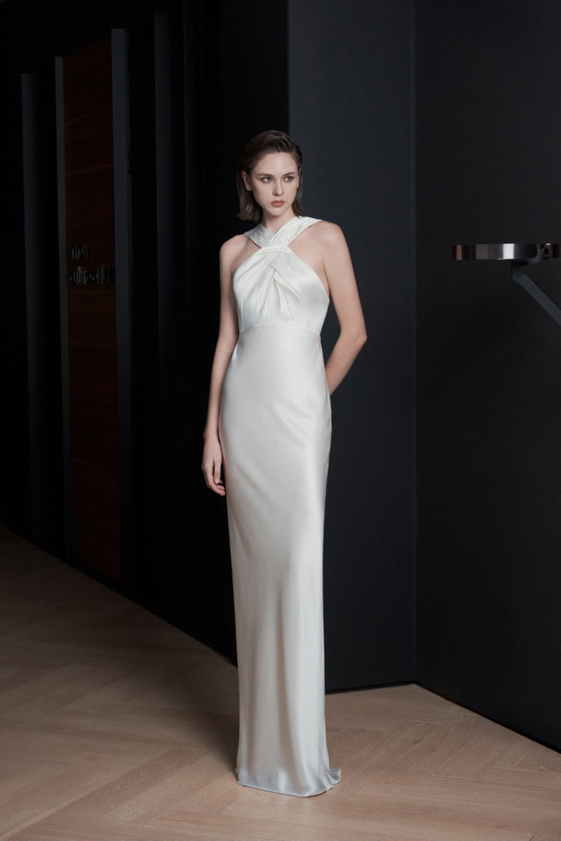 White Catania gown by Lekieu, elegant dress with flowing fabric and intricate detailing, perfect for formal occasions.