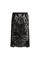 Black Scarlett Gasque Bianca midi skirt displayed on a model, showcasing its elegant design and flowy fabric.