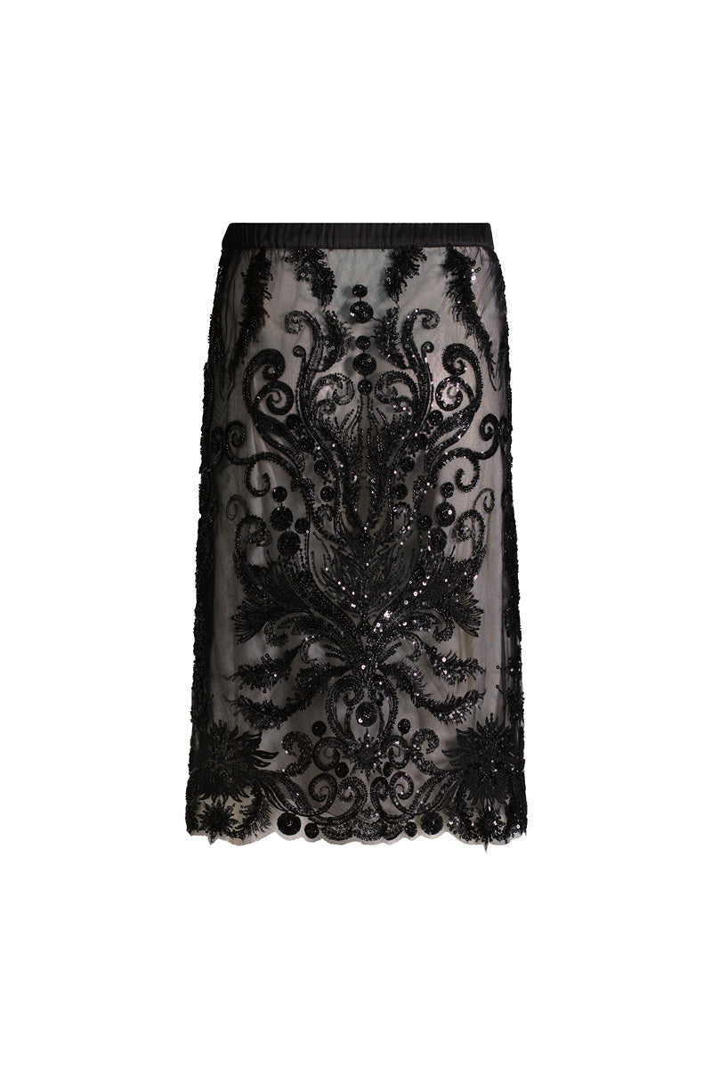 Black Scarlett Gasque Bianca midi skirt displayed on a model, showcasing its elegant design and flowy fabric.