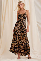Scarlett Gasque leopard print maxi dress featuring a flowy silhouette and long sleeves, styled for a fashionable look.