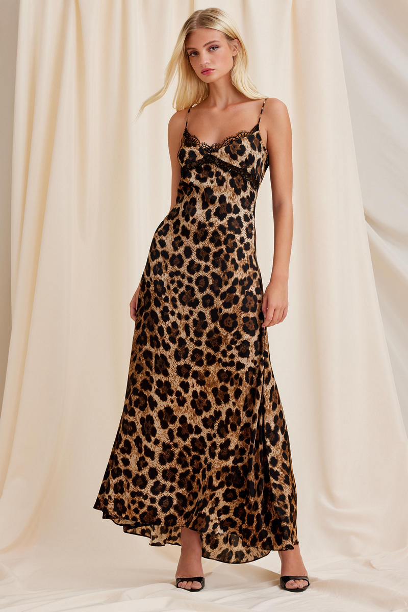 Scarlett Gasque leopard print maxi dress featuring a flowy silhouette and long sleeves, styled for a fashionable look.