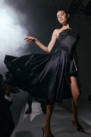 Black Lauren midi skirt by Scarlett Gasque, shown in a stylish, flowing design on a model.