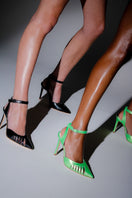 Lime-colored Terry de Havilland Maya heels with a sleek design, featuring pointed toes and stylish heel height.