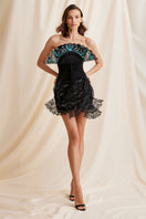Black Scarlett Gasque Elora mini skirt paired with a matching corset, showcasing a stylish, form-fitting design.