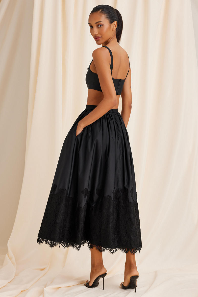 Black Scarlett Gasque Fiorella maxi skirt shown from the back, flowing fabric and elegant design.