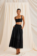 Scarlett Gasque black Fiorella maxi skirt displayed with full length and flowing fabric, perfect for elegant everyday wear.
