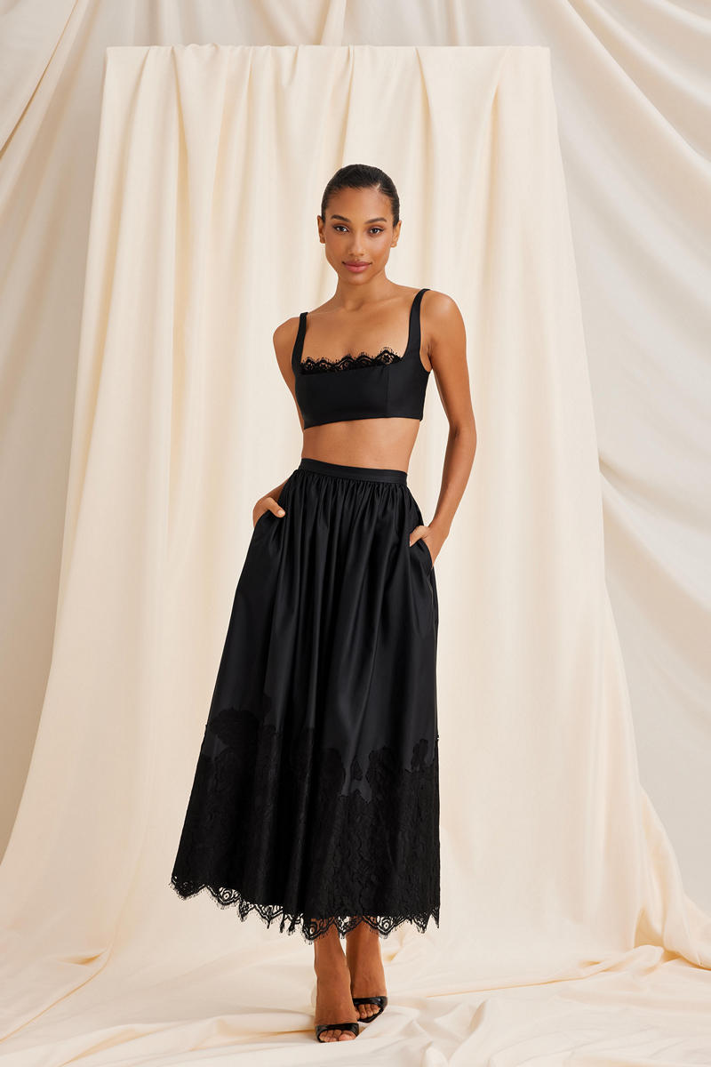 Scarlett Gasque black Fiorella maxi skirt displayed with full length and flowing fabric, perfect for elegant everyday wear.