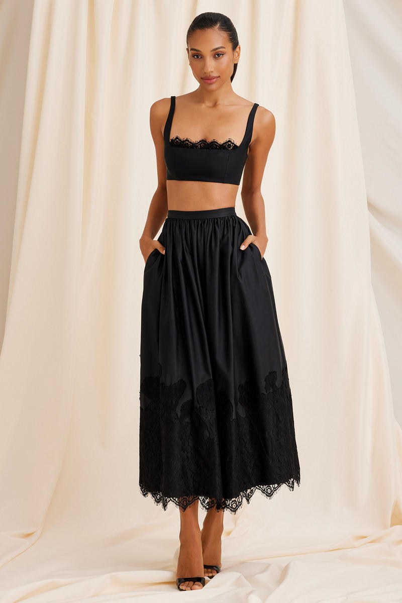 Black Fiorella top by Scarlett Gasque, close-up image showing the fitted design and fabric texture.