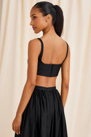 Black Fiorella top by Scarlett Gasque shown from the back, featuring sleek design and stylish fit.
