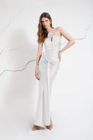White LEDIEL VARI MAXI SKIRT displayed on a hanger, showcasing its flowy fabric and elegant length.