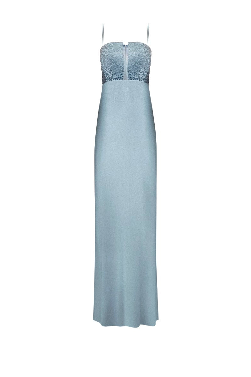 Blue Lecce maxi dress by Lekieu, flowing fabric with a fitted waist and elegant design, displayed on a hanger.