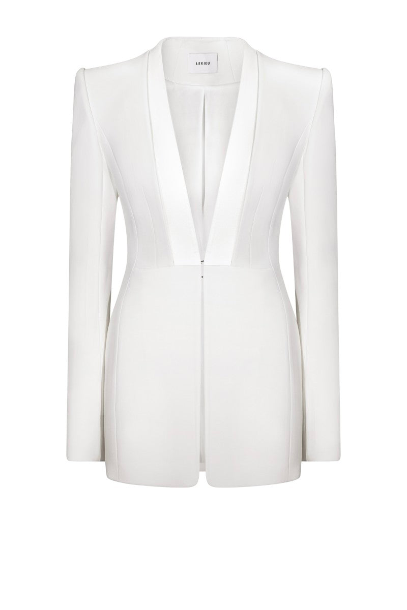 White LEKIEU Florence jacket displayed on a hanger with a sleek, minimalist design and clean fabric details.