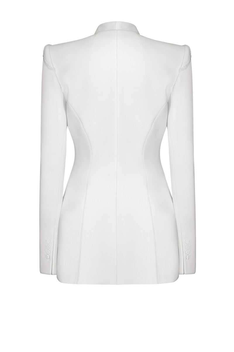 White LEKIEU Venice jacket displayed on a hanger, showcasing the stylish design and clean fabric.