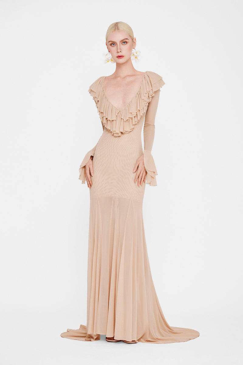 Valenciani Cult Mia X The Seraphina maxi dress displayed on a hanger, featuring flowing fabric and elegant design.