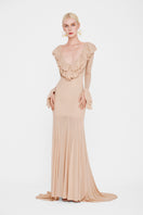 Valenciani Cult Mia X The Seraphina maxi dress displayed on a hanger, featuring flowing fabric and elegant design.