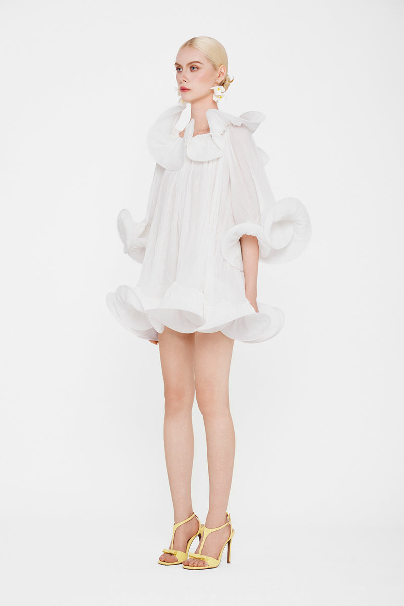 White Valenciani Origami Cloud mini dress shown on a hanger, featuring a lightweight, stylish design perfect for casual or party wear.