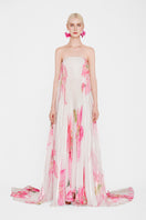 Valenciani CULT MIA X VALENCIANI The Blossom pleated maxi gown displayed on a hanger with flowing fabric and intricate pleats.