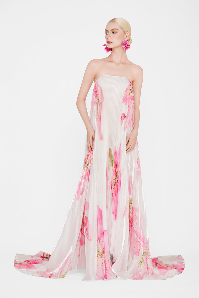 Valenciani CULT MIA X VALENCIANI Blossom pleated maxi gown with flowing fabric and floral design, perfect for elegant occasions.
