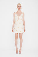 Valenciani Starfish mini dress in ivory, showcasing a stylish sleeveless design with a fitted bodice and flared skirt.