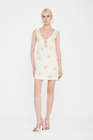 Valenciani starfish mini dress in ivory, details of the stylish sleeveless design and lightweight fabric, perfect for summer wear.